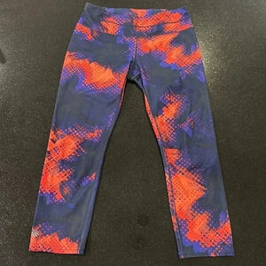 ATHLETA 3/4 Leggings in Red/Purple Pattern with Back zipper pouch Size Small